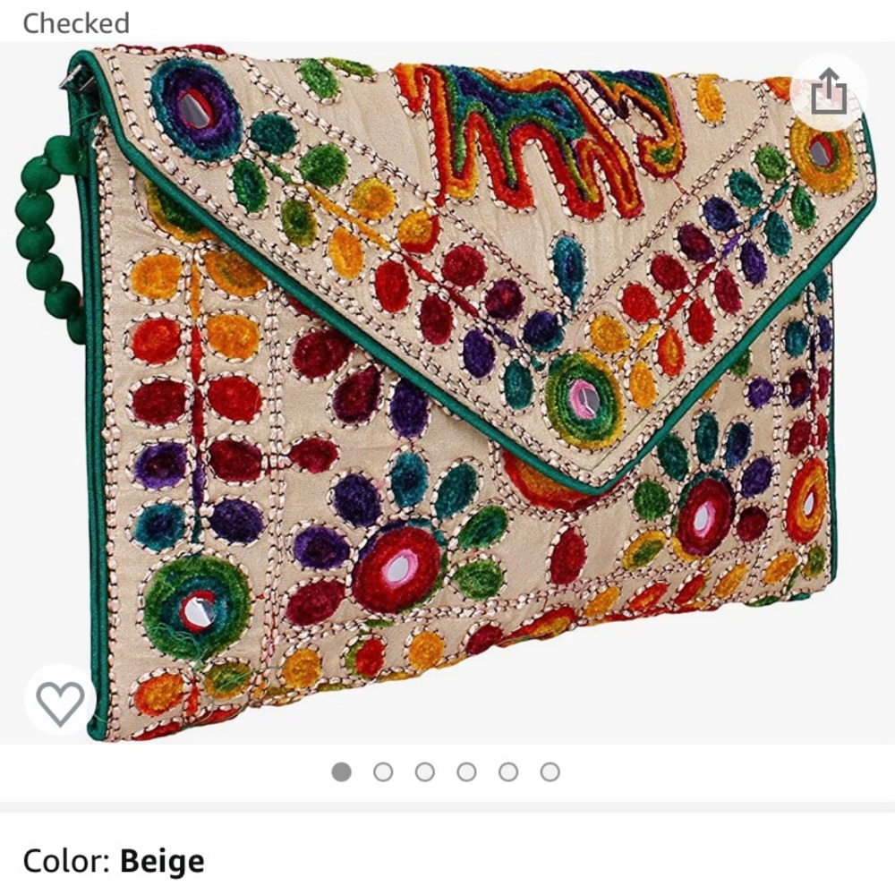 Clutch purse with pretty embroidery and sequins. Inside zipper